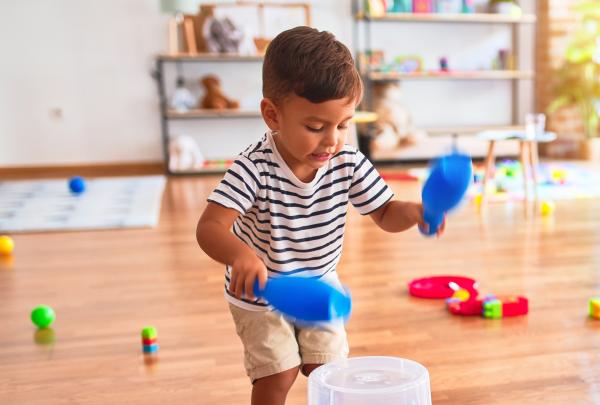 A toddler plays with toys.